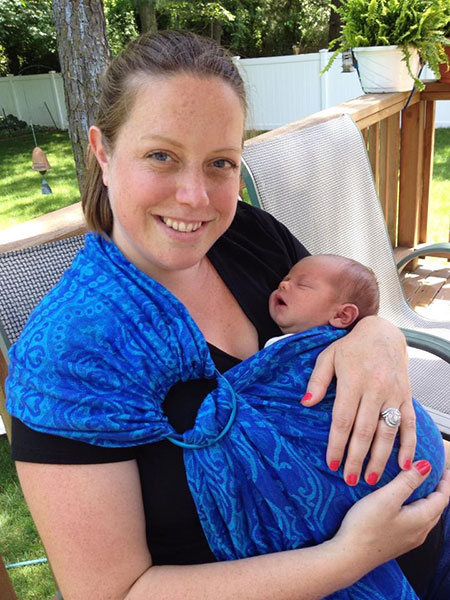 Kaitlin McGreyes, founder of BeHerVillage, with her newborn son.